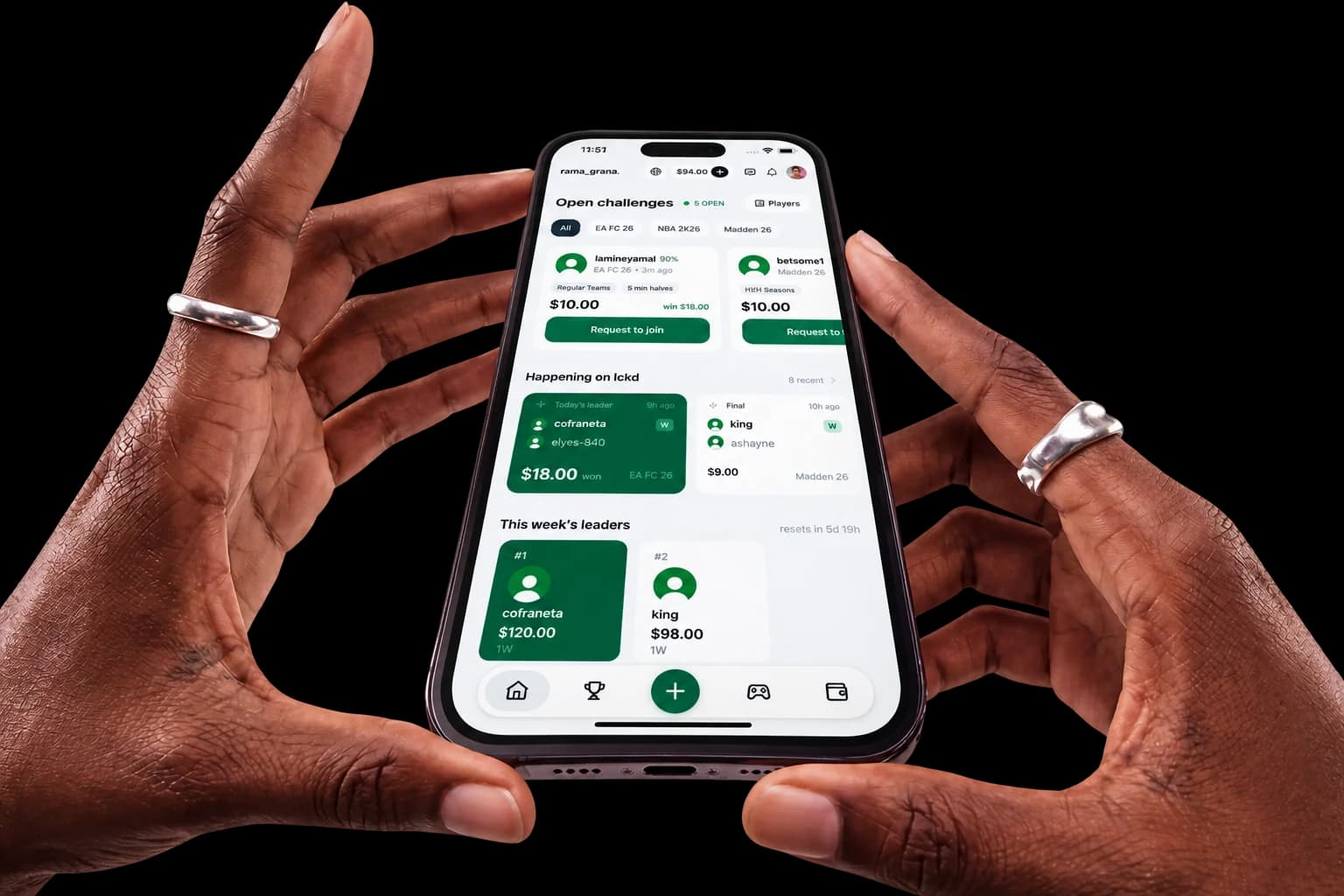 Two hands holding a phone with the Locked lobby open, showing open challenges, recent results and this week's leaders.
